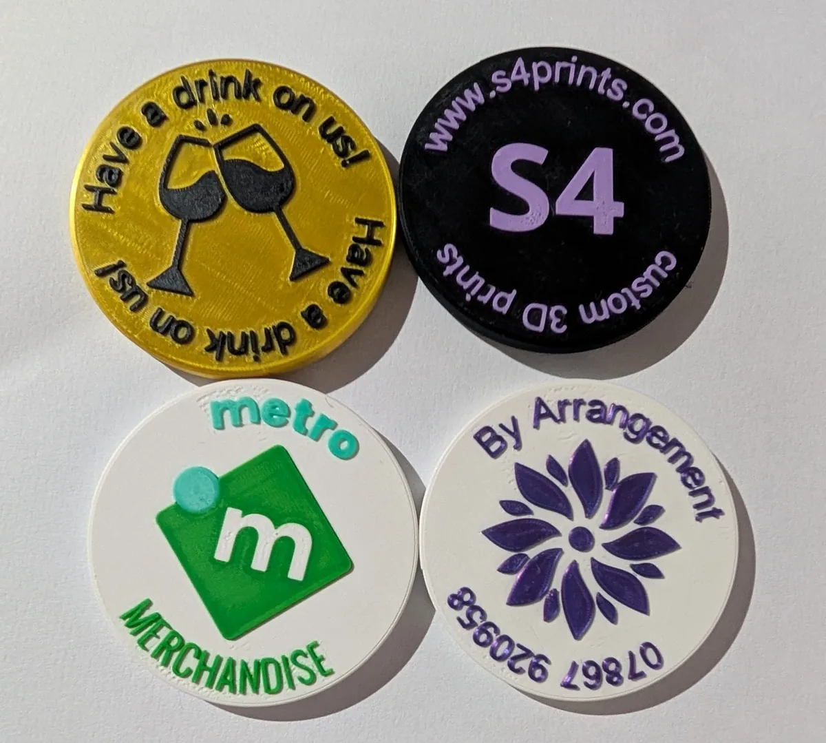 Front sides of custom printed round tokens